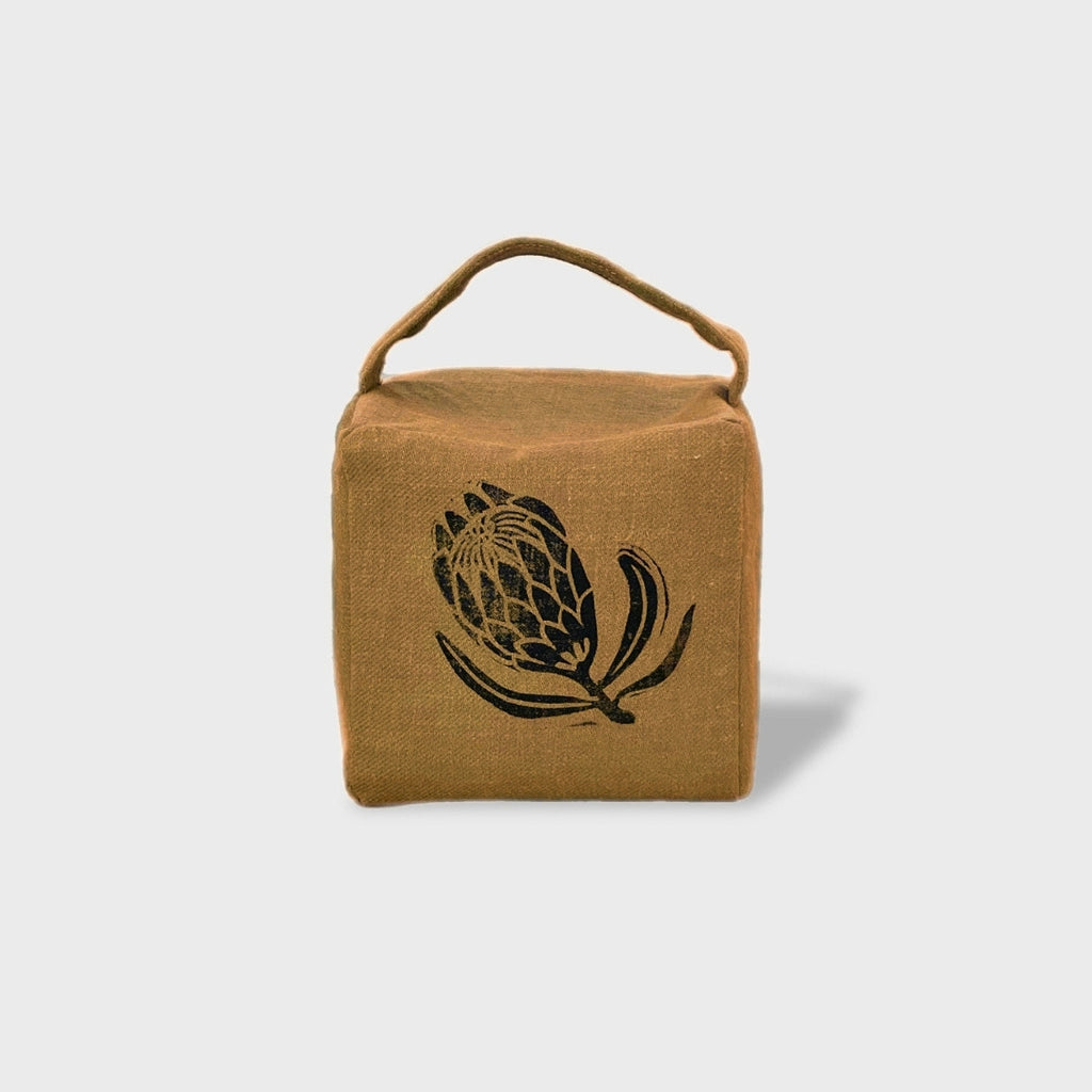 Suki the sugarbush doorstop in ochre