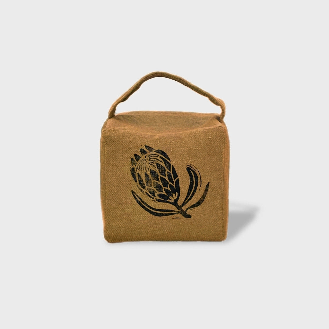 Suki the sugarbush doorstop in ochre