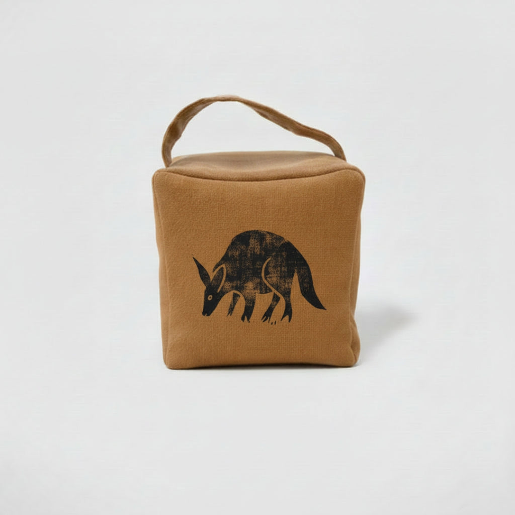Otis the aardvark doorstop in ochre