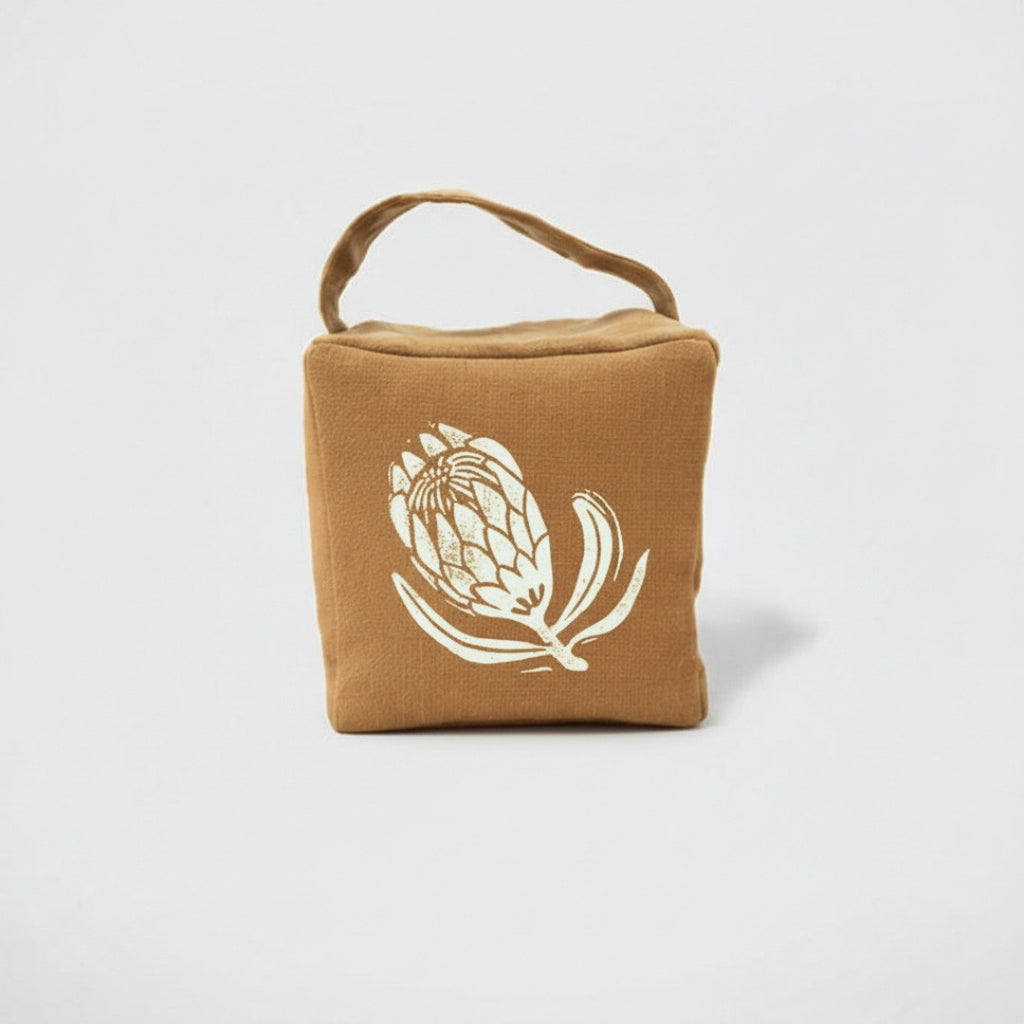 Suki the sugarbush doorstop in ochre