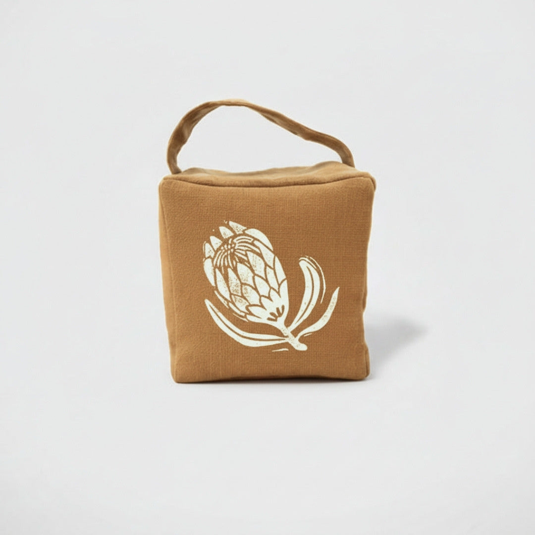 Suki the sugarbush doorstop in ochre