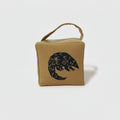 Rolo the pangolin doorstop in ochre