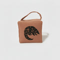 Rolo the pangolin doorstop in terracotta