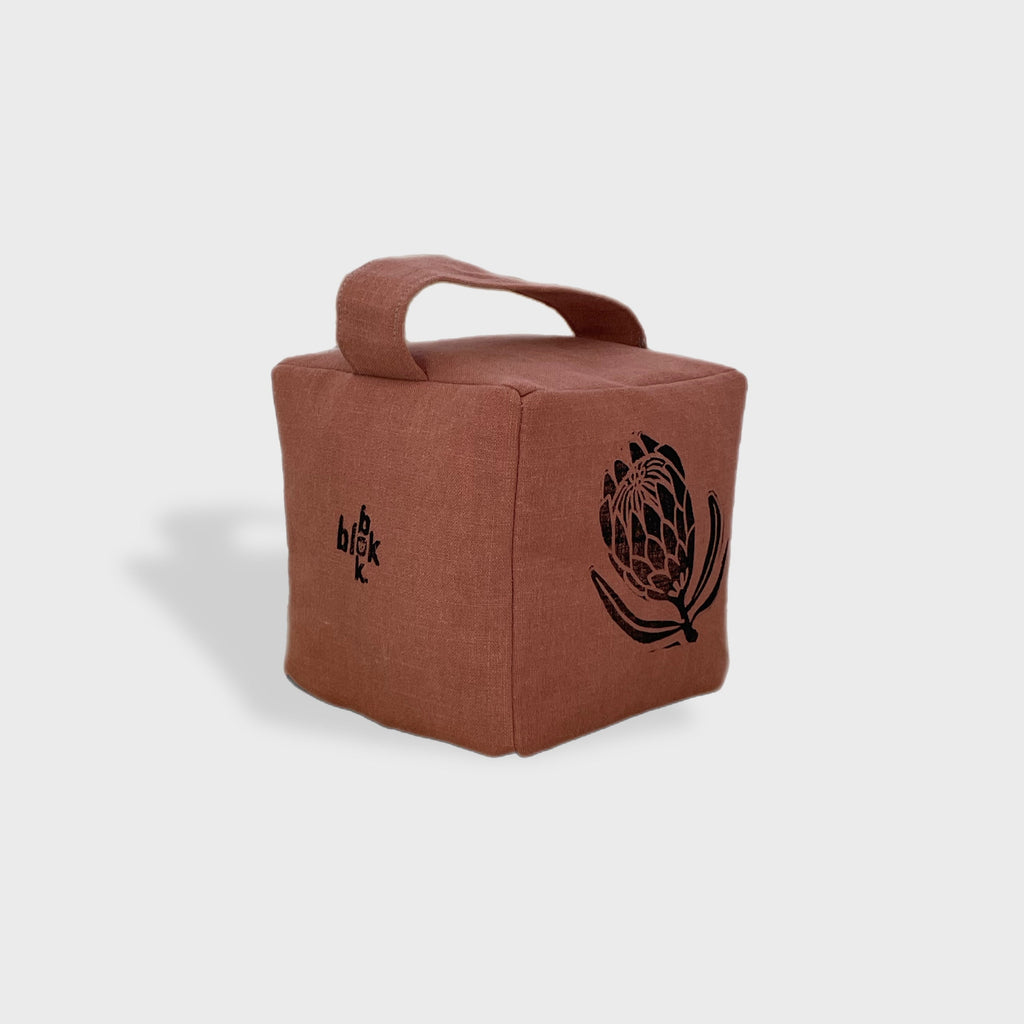 Suki the sugarbush doorstop in terracottta