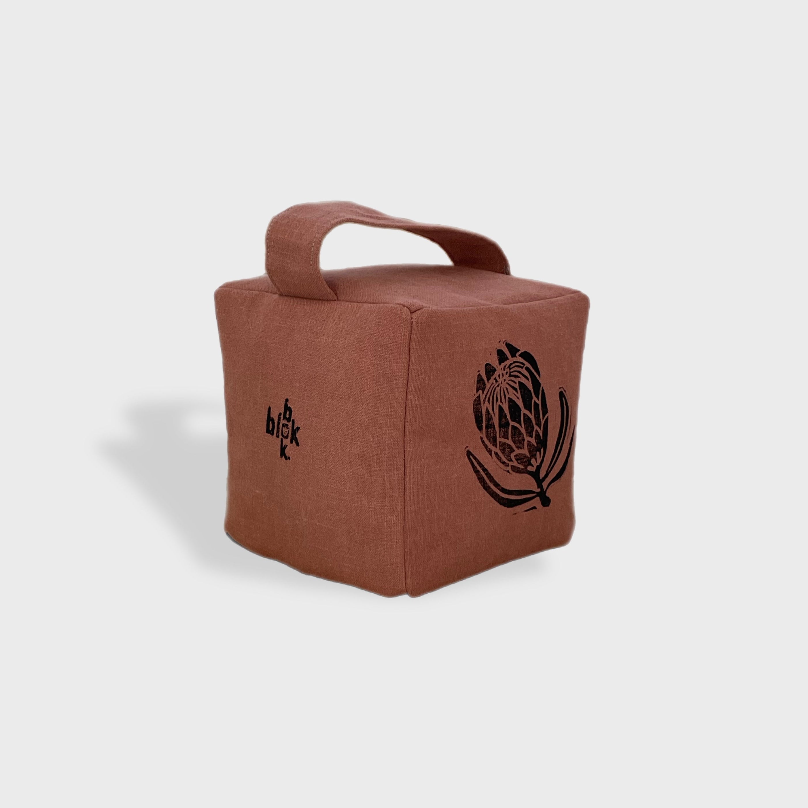 Suki the sugarbush doorstop in terracottta