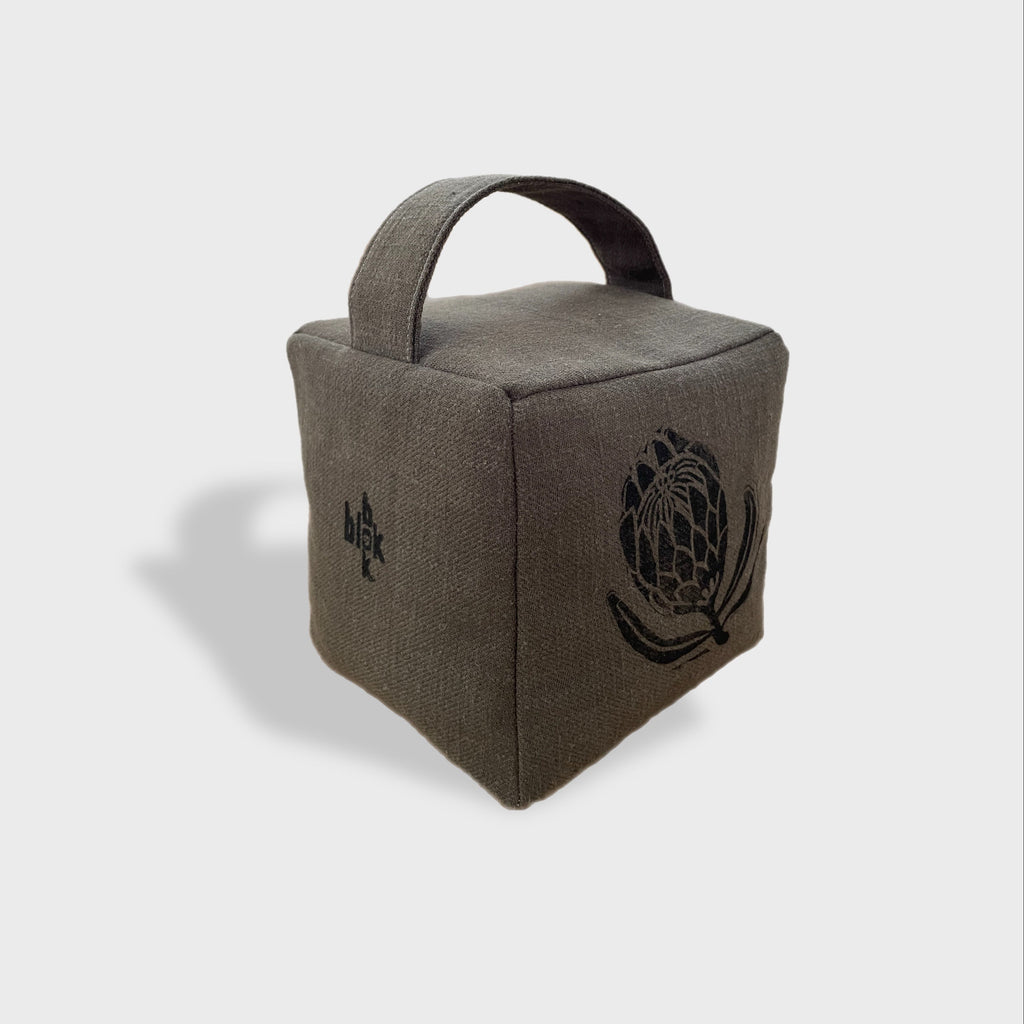 Suki the sugarbush doorstop in charcoal