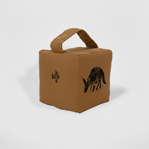 Muted ochre aardvark doorstop - angled view