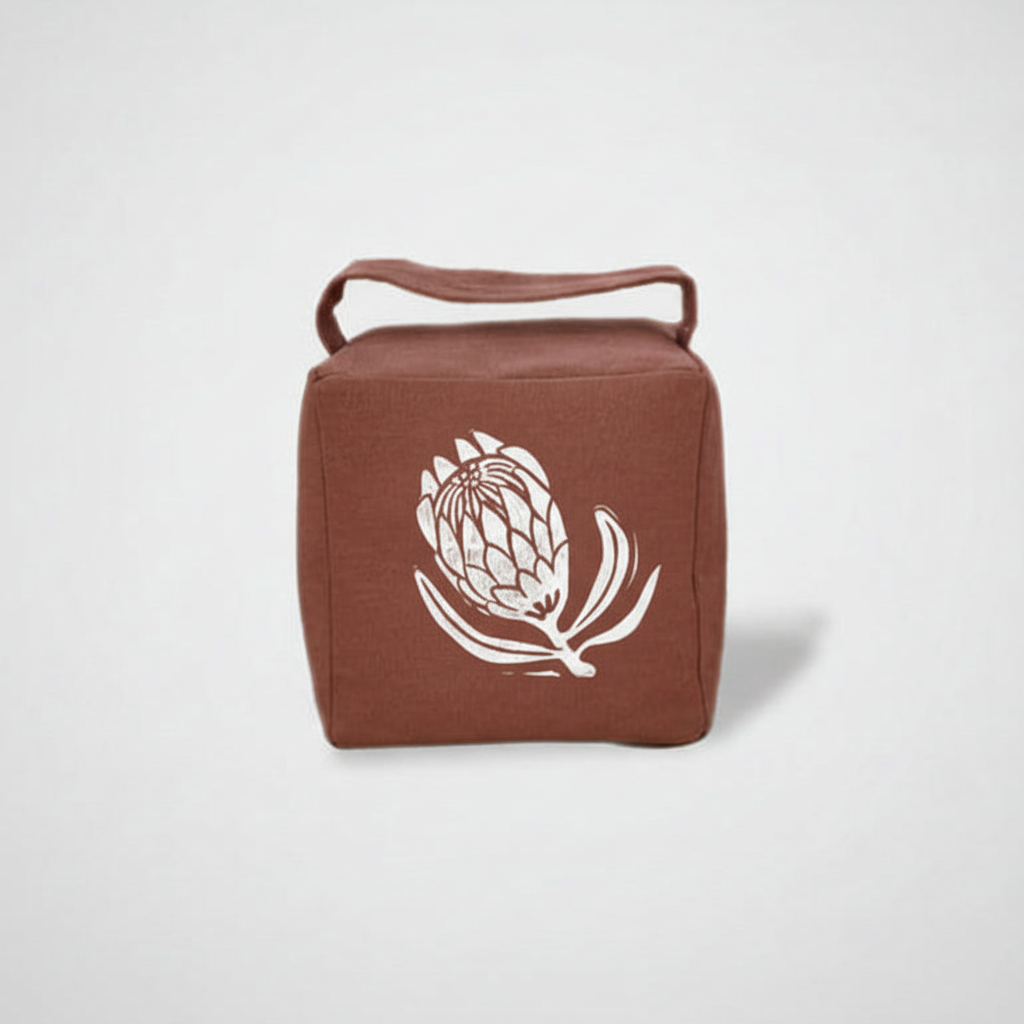 Suki doorstop with white ink protea