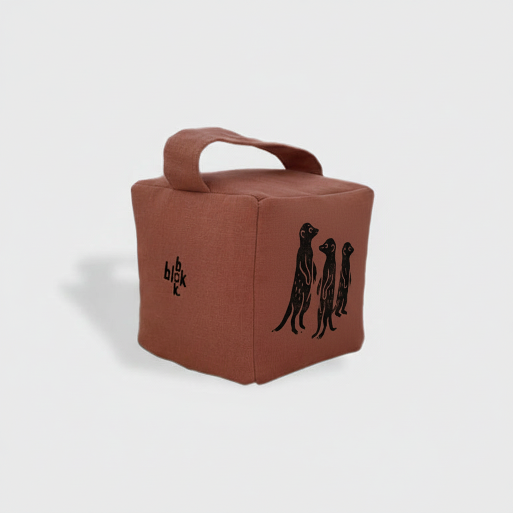 Terracotta doorstop with black ink meerkat print - angled view