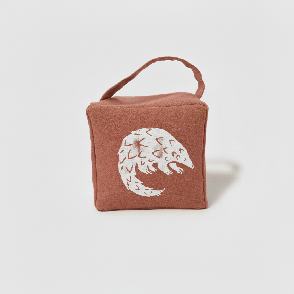 Terracotta Rolo pangolin doorstop with white ink - front view