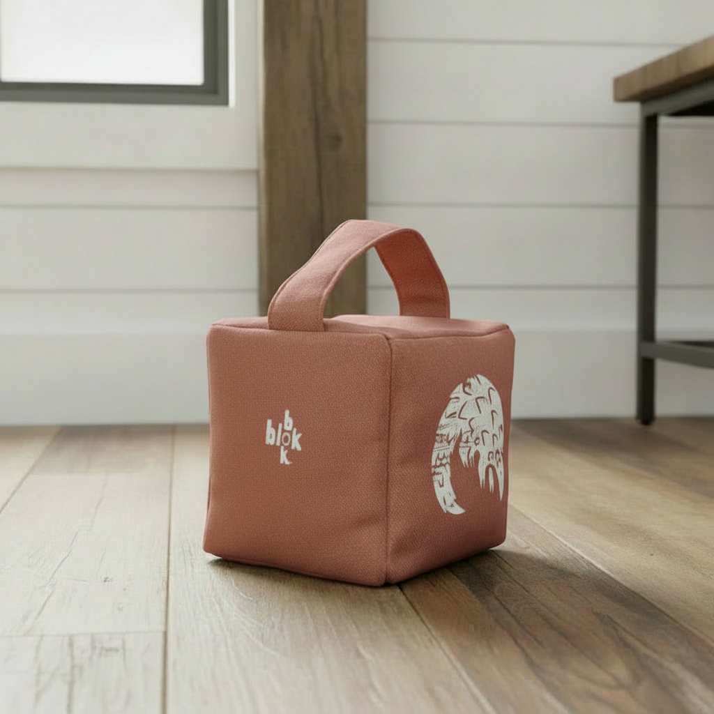 Terracotta Rolo pangolin doorstop with white ink - lifestyle setting